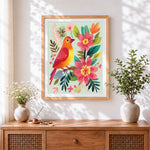 Finished colourful bird in a floral garden cross stitch artwork displayed
