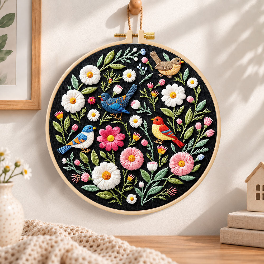Colourful birds and wildflowers embroidery hoop wall art displayed as warm and cosy handmade home decor