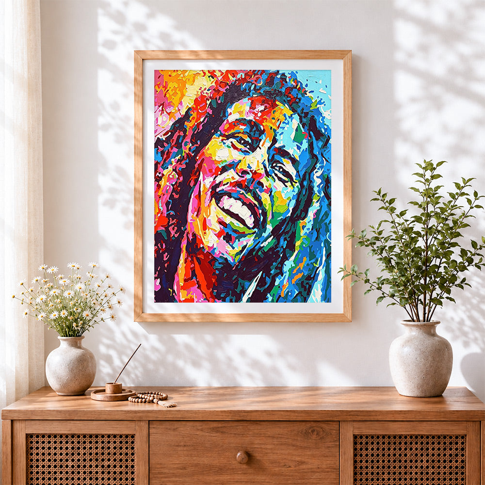 Finished colourful bob marley portrait cross stitch artwork displayed
