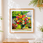 Finished colourful bouquet in a bucket cross stitch artwork displayed