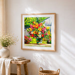 Colourful bouquet in a bucket cross stitch artwork displayed on wall as home decor