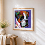 Colourful boxer dog portrait cross stitch artwork displayed on wall as home decor