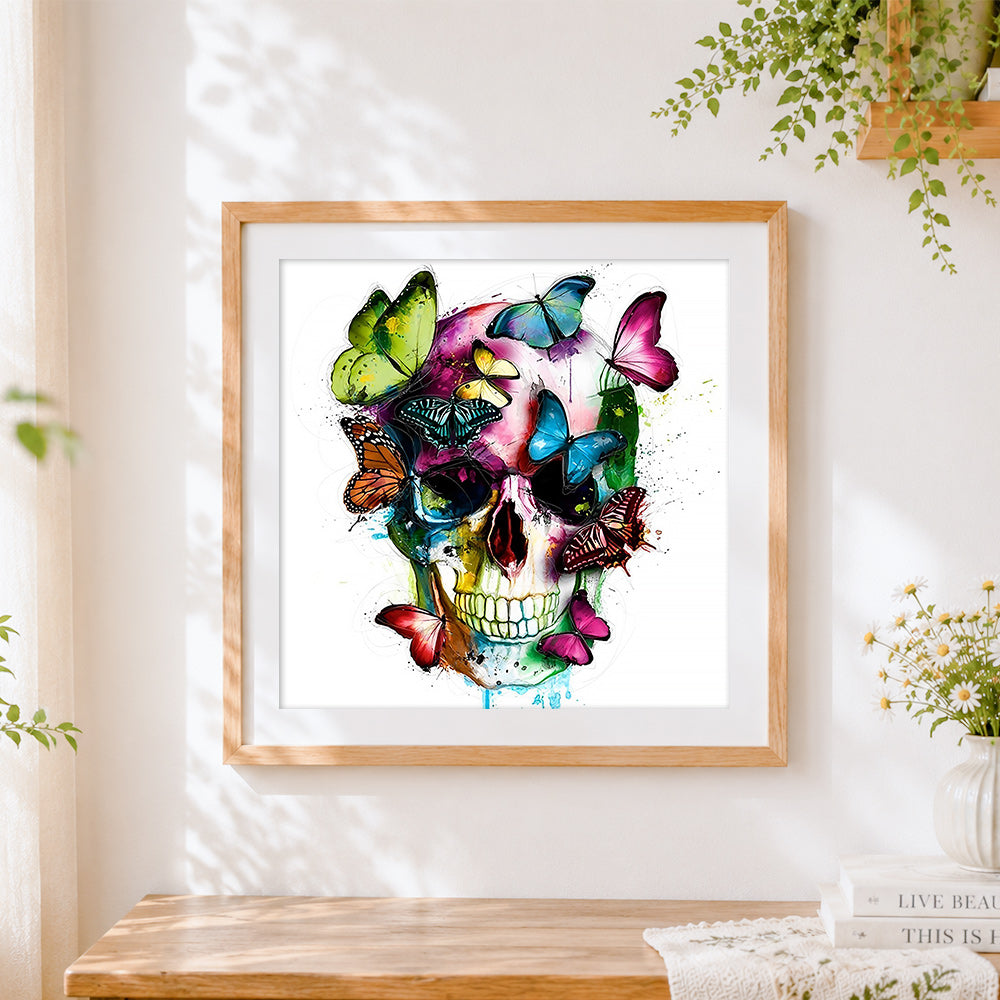 Finished colourful butterflies and skull cross stitch artwork displayed