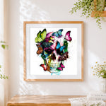 Finished colourful butterflies and skull paint by numbers artwork displayed as home decor