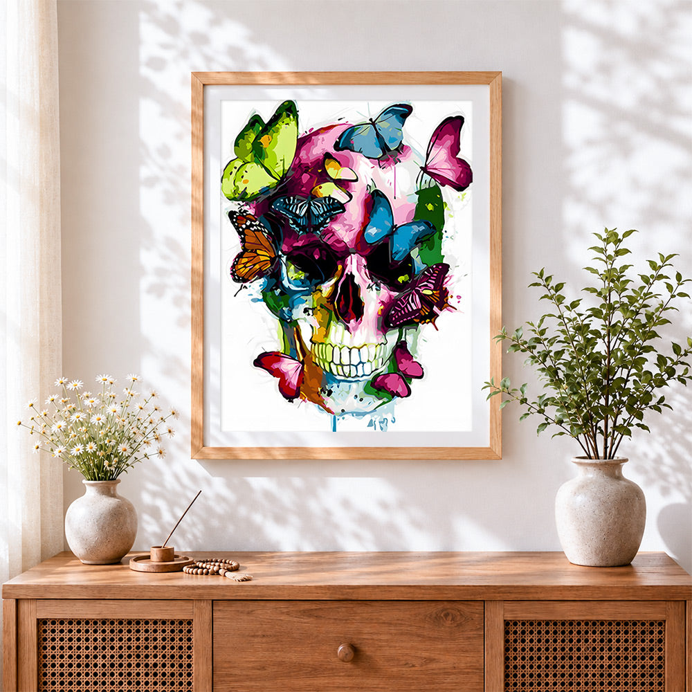 Finished colourful butterflies on the skull cross stitch artwork displayed