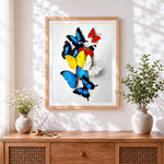 Finished colourful butterfly collection cross stitch artwork displayed