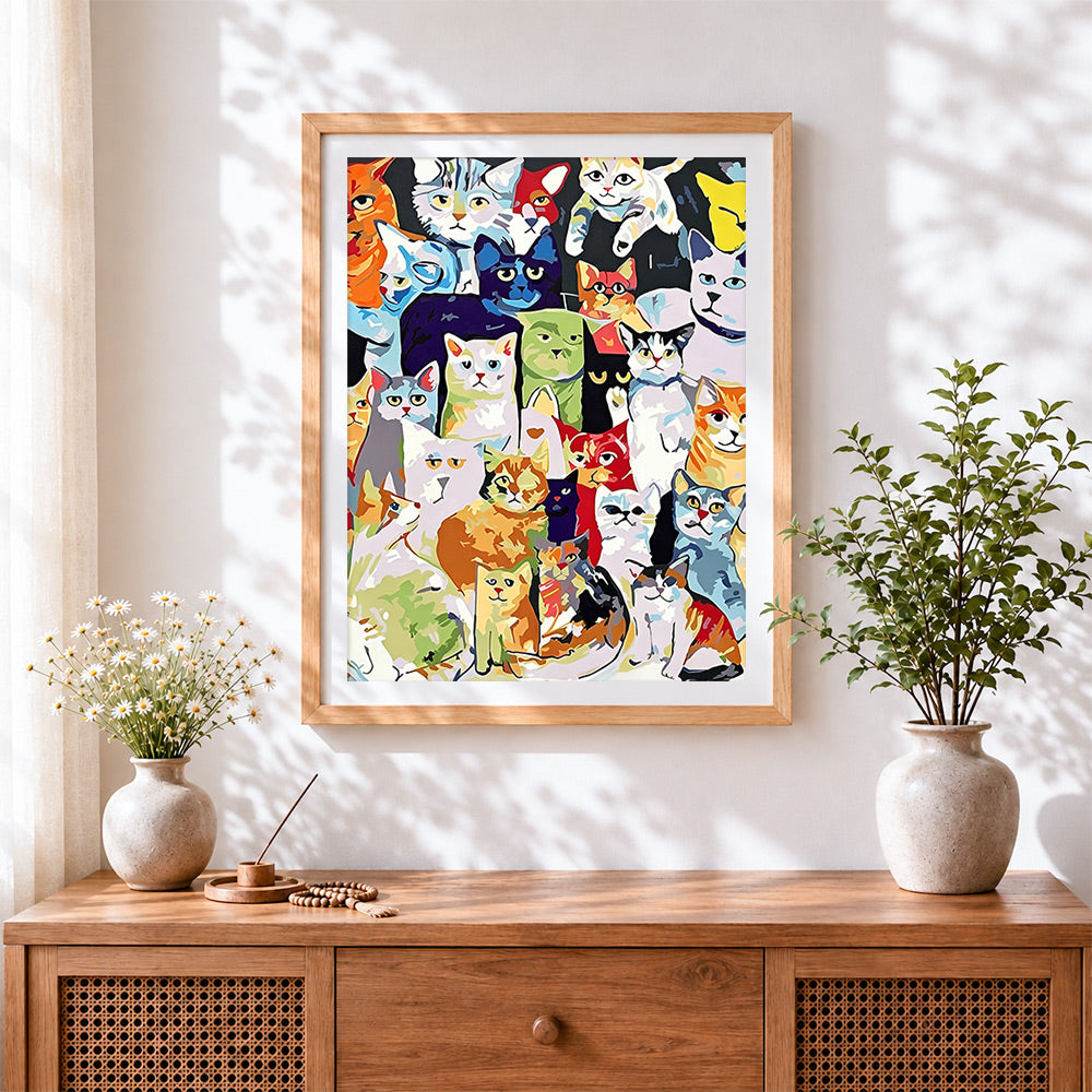 Finished colourful cartoon cats cross stitch artwork displayed