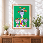 Finished colourful cartoon giraffes cross stitch artwork displayed