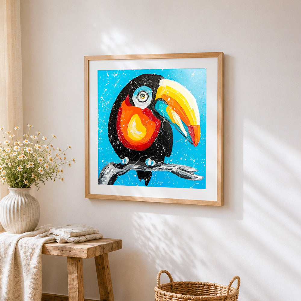 Colourful cartoon toucan cross stitch artwork displayed on wall as home decor