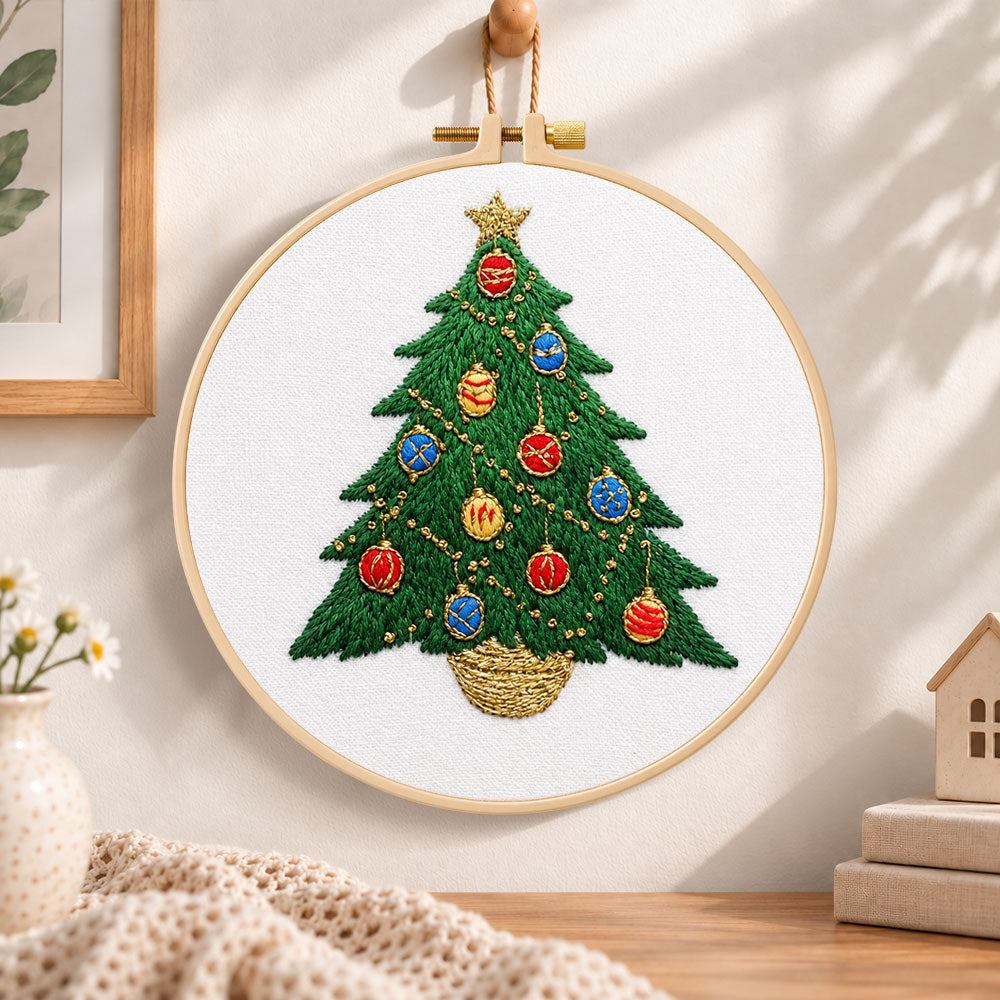 Colourful christmas tree embroidery hoop wall art displayed as warm and cozy handmade home decor