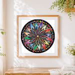 Finished colourful circular mandala cross stitch artwork displayed