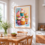 Colourful cupcakes cross stitch artwork displayed on wall as home decor