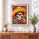 Finished colourful day of the dead skull cross stitch artwork displayed