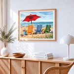 Colourful deck chairs on a sandy beach cross stitch artwork displayed on wall as home decor