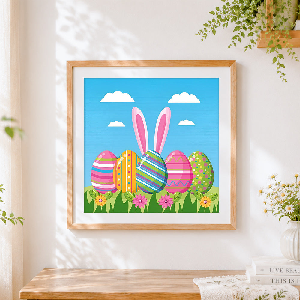 Finished colourful easter eggs and bunny ears cross stitch artwork displayed