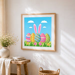 Colourful easter eggs and bunny ears cross stitch artwork displayed on wall as home decor