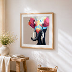 Colourful elephant portrait cross stitch artwork displayed on wall as home decor
