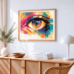 Colourful eye cross stitch artwork displayed on wall as home decor
