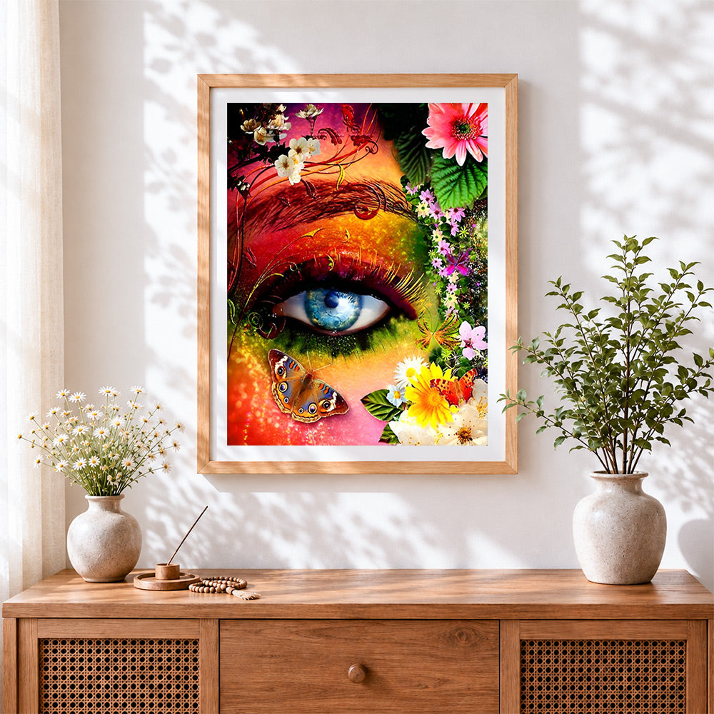 Finished colourful eye with flowers cross stitch artwork displayed