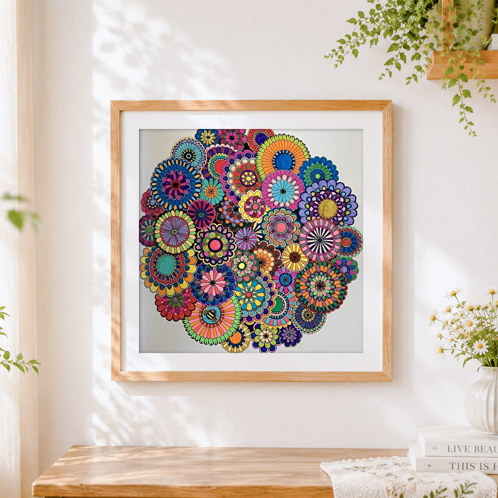 Finished colourful floral mandala collage cross stitch artwork displayed