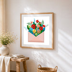 Colourful flowers in an envelope cross stitch artwork displayed on wall as home decor