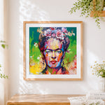Finished colourful frida kahlo portrait cross stitch artwork displayed