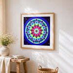 Colourful geometric star mandala cross stitch artwork displayed on wall as home decor