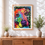 Finished colourful graffiti dog cross stitch artwork displayed
