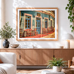 Finished colourful greek taverna cross stitch artwork displayed