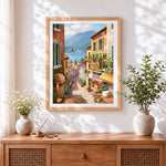 Finished colourful hillside village and café cross stitch artwork displayed