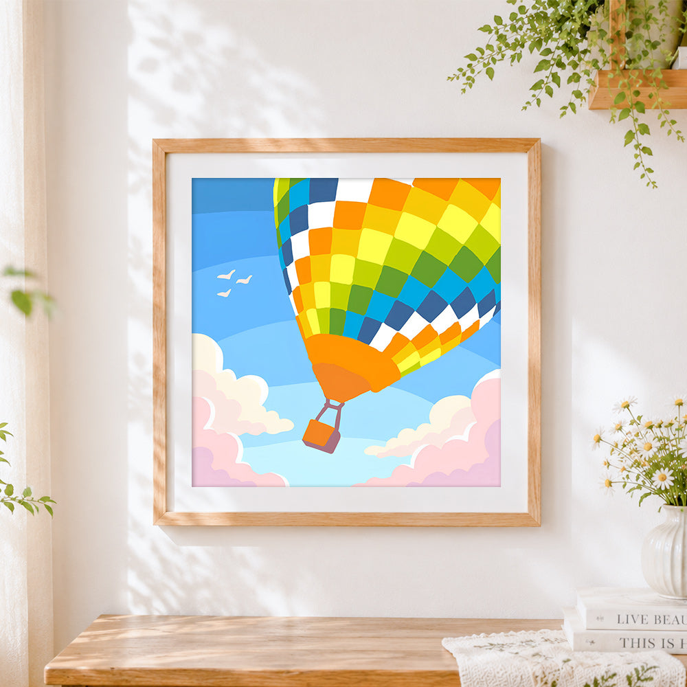 Finished colourful hot air balloon cross stitch artwork displayed
