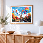 Colourful hot air balloons over eiffel tower cross stitch artwork displayed on wall as home decor