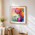 Colourful hummingbird and flowers cross stitch artwork displayed on wall as home decor