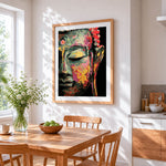 Colourful impasto buddha face cross stitch artwork displayed on wall as home decor