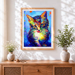 Finished colourful impasto cat cross stitch artwork displayed