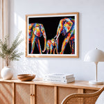 Colourful impasto elephant family cross stitch artwork displayed on wall as home decor