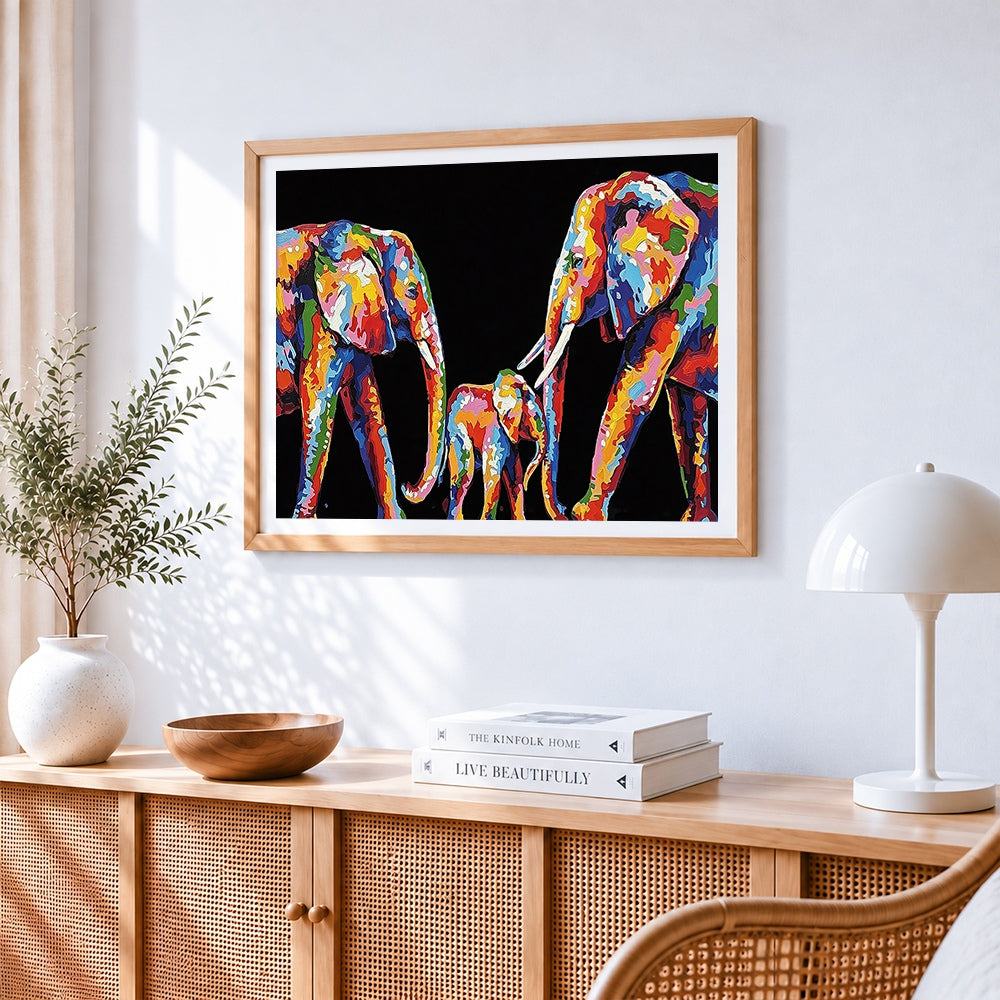 Colourful impasto elephant family cross stitch artwork displayed on wall as home decor
