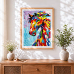 Finished colourful impasto horse cross stitch artwork displayed