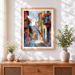 Finished colourful italian street cross stitch artwork displayed