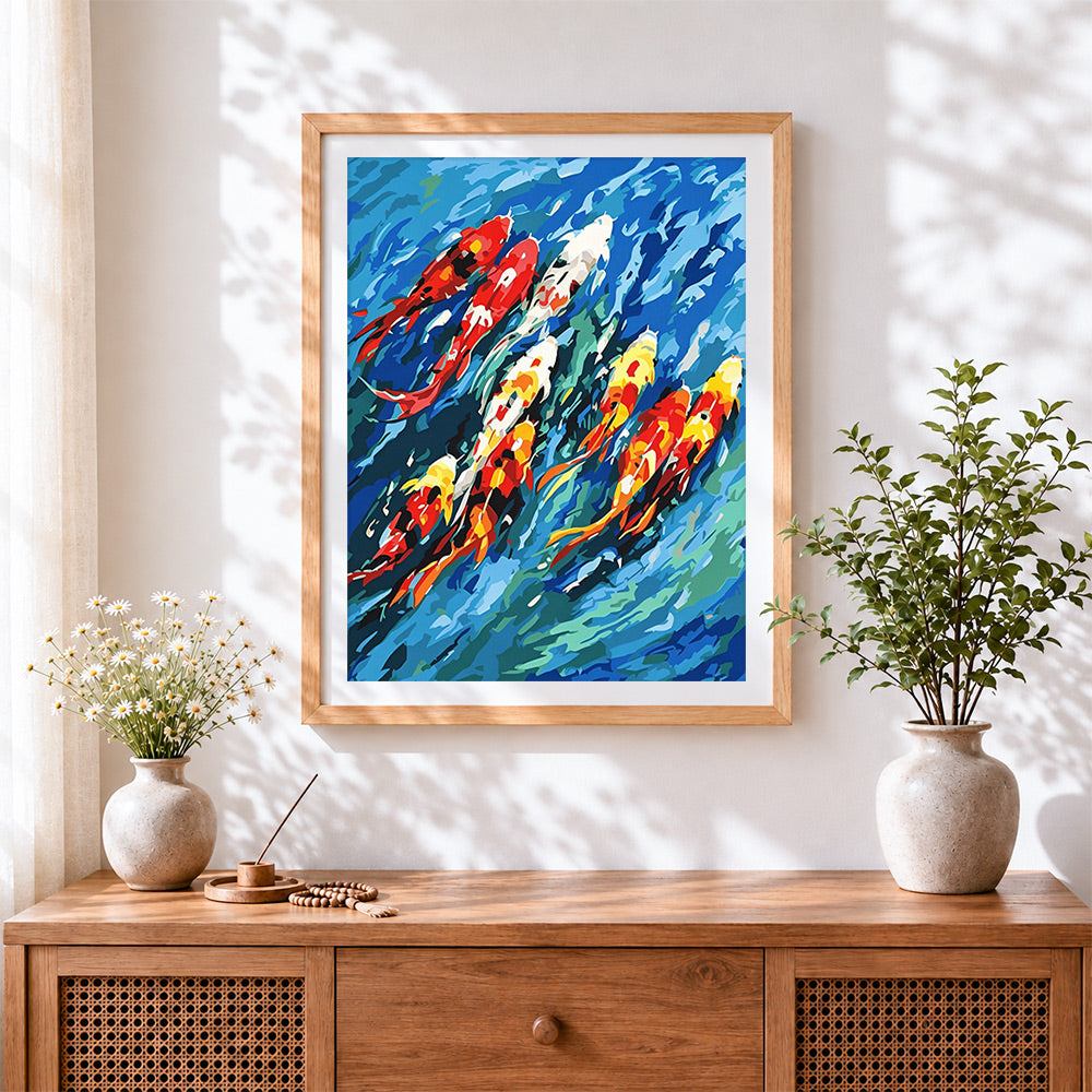 Finished colourful koi fish in blue water cross stitch artwork displayed