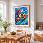 Colourful koi fish in blue water cross stitch artwork displayed on wall as home decor