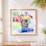 Finished colourful lilies on a windowsill cross stitch artwork displayed