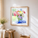 Colourful lilies on a windowsill cross stitch artwork displayed on wall as home decor