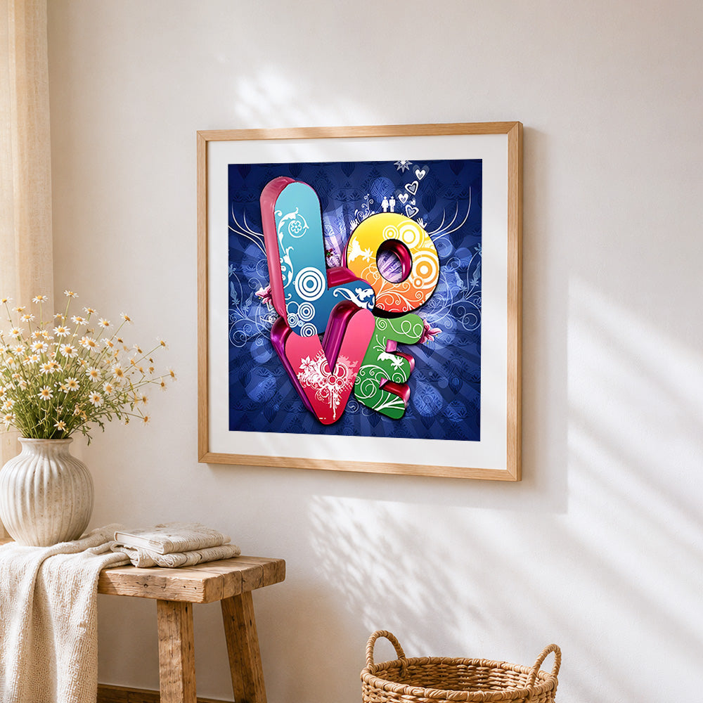 Colourful "love" typography cross stitch artwork displayed on wall as home decor