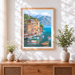 Finished colourful mediterranean coastal town cross stitch artwork displayed