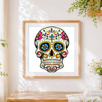 Finished colourful mexican sugar skull cross stitch artwork displayed