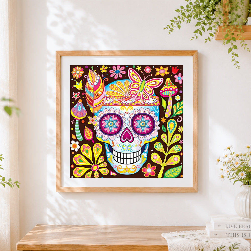 Finished colourful mexican sugar skull with butterfly cross stitch artwork displayed