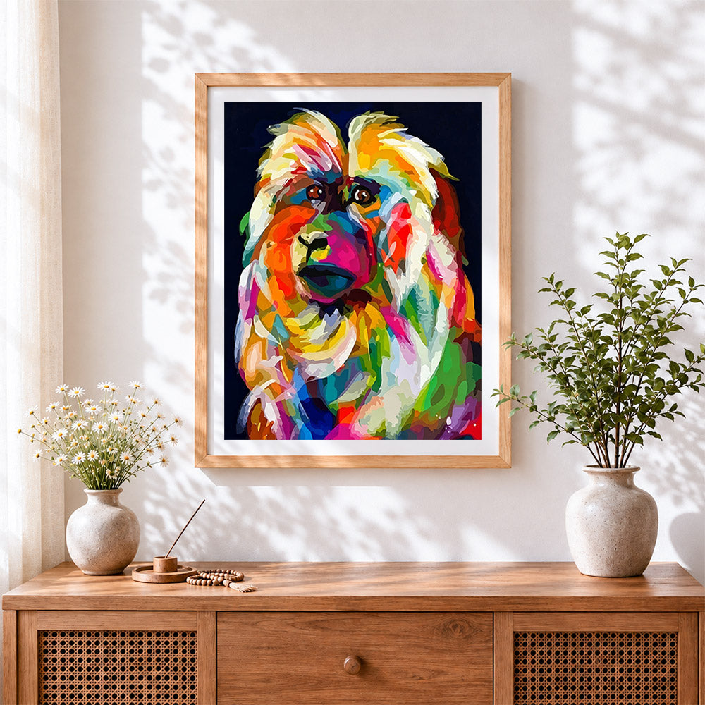 Finished colourful monkey in the dark cross stitch artwork displayed