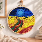 Colourful mountain sunset embroidery hoop wall art displayed as warm and cozy handmade home decor