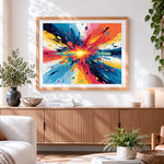 Finished colourful paint splash cross stitch artwork displayed